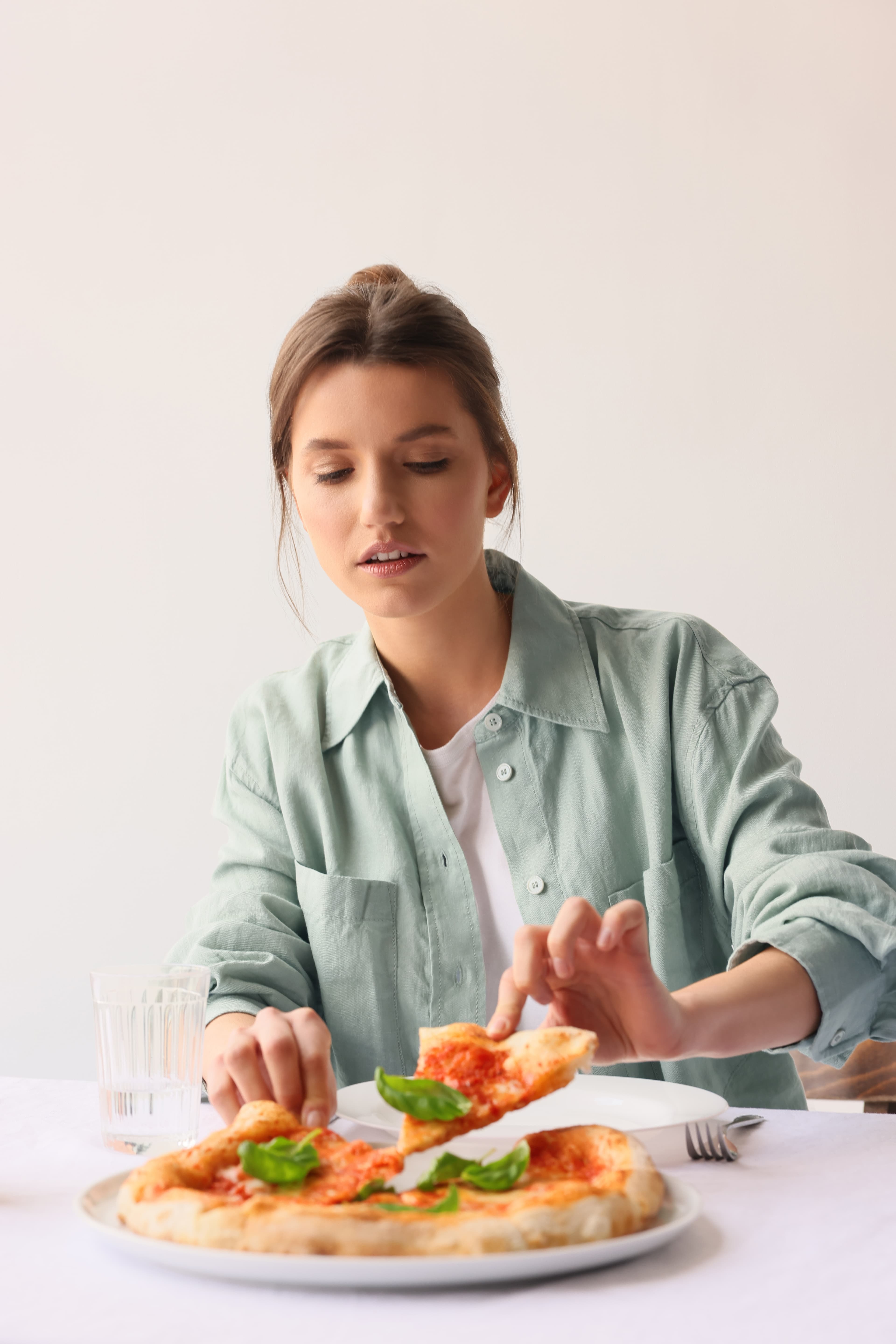 Woman eating pizza